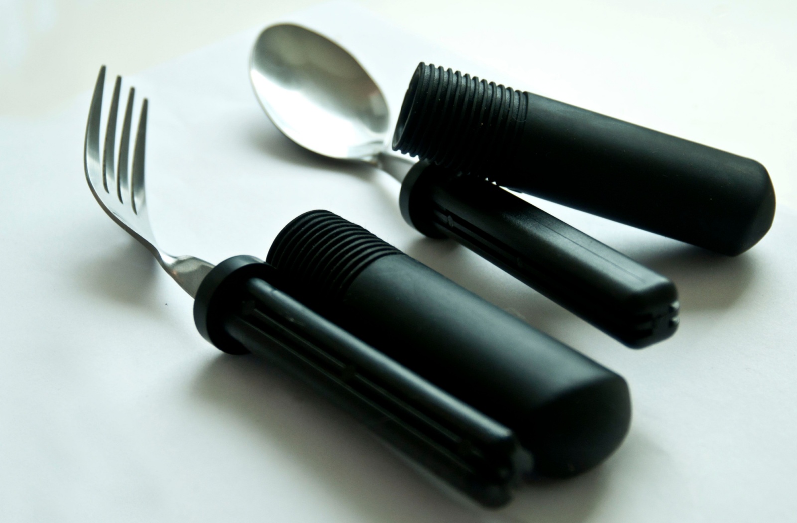 A set of adaptive utensils, with larger grips that are easier for a senior returning from rehabilitation to hold.